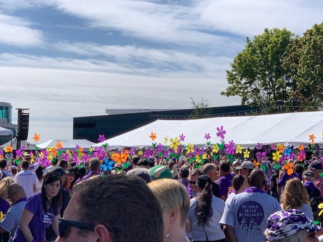 Holding up flowers at the Walk to End Alzheimer's in Portland, Oregon